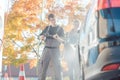 Service man helping woman cleaning her auto in car wash Royalty Free Stock Photo