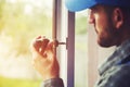 Service man installing window