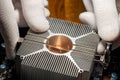 A service man mounting air cooled passive heatsink onto computer CPU Royalty Free Stock Photo