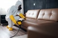 pest exterminator pesticide kill uniform insect control sofa termite cockroach. Generative AI. Royalty Free Stock Photo