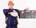 Service and payment concept. Builder earn money, repairman holds cash, Royalty Free Stock Photo