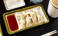 Steamed Yaki Gyoza served in a plate with sauce Royalty Free Stock Photo