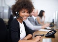 Service with a smile. Portrait of an attractive young female call center operator. Royalty Free Stock Photo