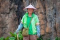 Service staff in the Hainan Tropical Wildlife Parc and Botanical Garden. Chinese woman in uniform