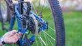 Service technician adjusting bike gears Royalty Free Stock Photo