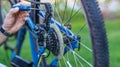 Service technician adjusting bike gears Royalty Free Stock Photo