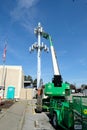 A service technician servicing a cell phone tower