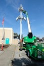 A service technician servicing a cell phone tower