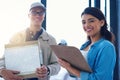 For a service thatll leave you smiling. Portrait of a young woman signing for a delivery from the courier.