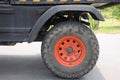 Service truck tractor rear wheel with bright red painted hub