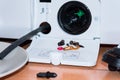 Service of the washing machine, got a small garbage from the filter Royalty Free Stock Photo
