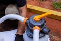 Home maintenance project involves cleaning pool filter to ensure efficient water circulation hygiene Royalty Free Stock Photo