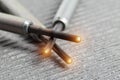 Serviceable modern ceramic glow plugs on a gray background. Orange glow, heating element. Pre-heating of a diesel engine Royalty Free Stock Photo