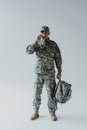 serviceman in cap and army uniform