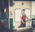 Serviceman in a car workshop