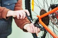 serviceman installing assembling or adjusting bicycle gear on wh Royalty Free Stock Photo