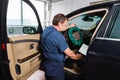 Serviceman making car diagnostics with laptop Royalty Free Stock Photo