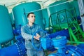 Serviceman operating industrial water purification or filtration equipment Royalty Free Stock Photo