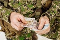 Serviceman with russian ruble money his hand.