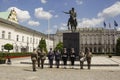 Servicemen of honor guard of army near statue of Prince Poniatowski in front of Presidential Palace. Warsaw, Poland Royalty Free Stock Photo