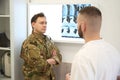 Military patient discussing results of computed tomography with doctor Royalty Free Stock Photo