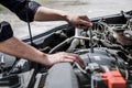 Services car engine machine concept, Automobile mechanic repairman hands repairing a car engine automotive workshop with a wrench