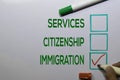 Services. Citizenship, Immigration with red checklist write on white board background