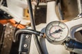 Pressure gauge connected to outboard engine