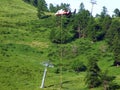 Servicing with repair of the ski lift and delivery of new parts by helicopter on the slopes of the Liechtenstein Alps