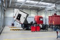 Servicing and repairing trucks in a large garage. Car service and truck maintenance. Auto mechanic checking the truck in Royalty Free Stock Photo