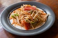 Serving of authentic Som Tam, or Thai salad made up of multiple fruits and vegetables like papaya with sweet and sour