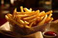 Serving basket filled with golden and perfectly crispy French fries. The lighting is warm and inviting, highlighting the texture