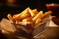 Serving basket filled with golden and perfectly crispy French fries. The lighting is warm and inviting, highlighting the texture