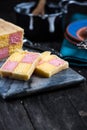 Serving Battenberg checked cake Royalty Free Stock Photo