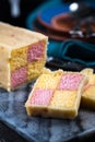 Serving Battenberg checked cake Royalty Free Stock Photo