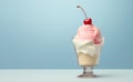 A serving of cherry ice cream topped with fresh berry in a glass sundae bowl against a soft blue background