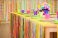 Serving colorful table with decoration for child birthday