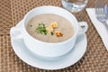 Serving of cream wild mushroom soup at restaurant