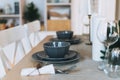 Serving festive table, grey plates, minimalism, scandinavian design at living room Royalty Free Stock Photo