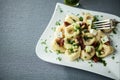 Serving of feta cheese, pesto and tortellini pasta Royalty Free Stock Photo