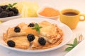 Serving French Crepes with fresh berries and honey on the plate Royalty Free Stock Photo
