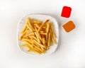 Serving French fries on a white background top view-2