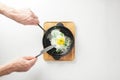 Serving fried eggs in cast iron pan microgreen sprouts baby beans pea and sunflower on white background, top view Royalty Free Stock Photo