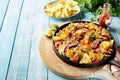 Serving of gourmet beef entrecote and nachos