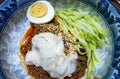 Serving of Korean cold noodles bibim naengmyeon