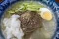 Serving of Korean cold noodles soup mul naengmyeon