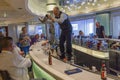 Serving multiple 7 cocktails at the same time at the bar on a cruise ship