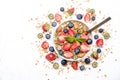 Ceramic granola bowl, assorted ingredients on table. Healthy nutritious breakfast with vegan yogurt, raw fruits, nuts and cereals. Royalty Free Stock Photo