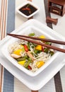 Serving of oriental warm noodle chicken salad Royalty Free Stock Photo