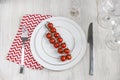 Serving plate, spoon, fork, knife and red napkin Royalty Free Stock Photo